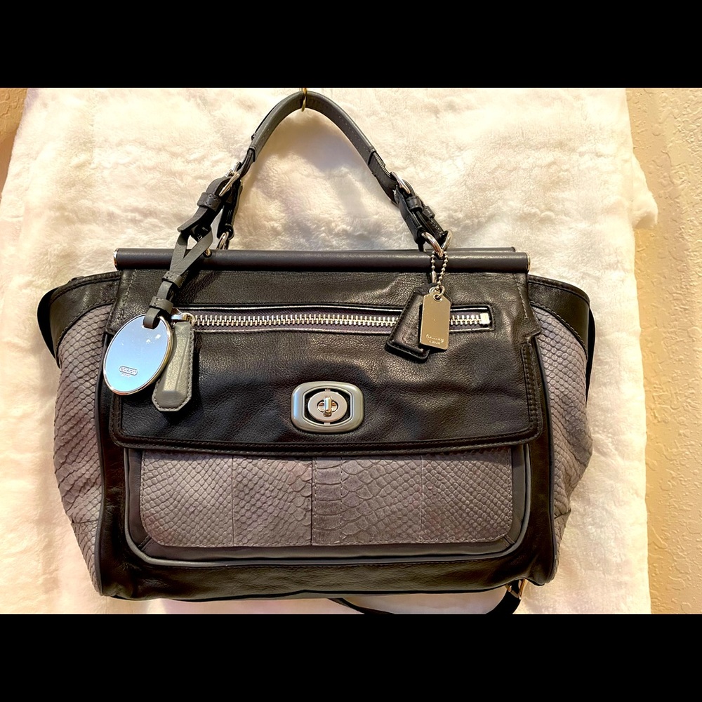 Black leather with snakeskin trim.Barely used